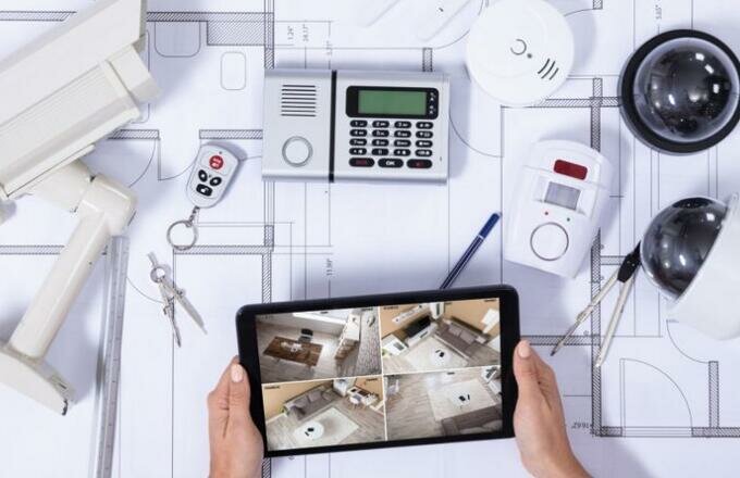 person-monitoring-smart-house-on-digital-tablet-picture-id1125366038-1030x488